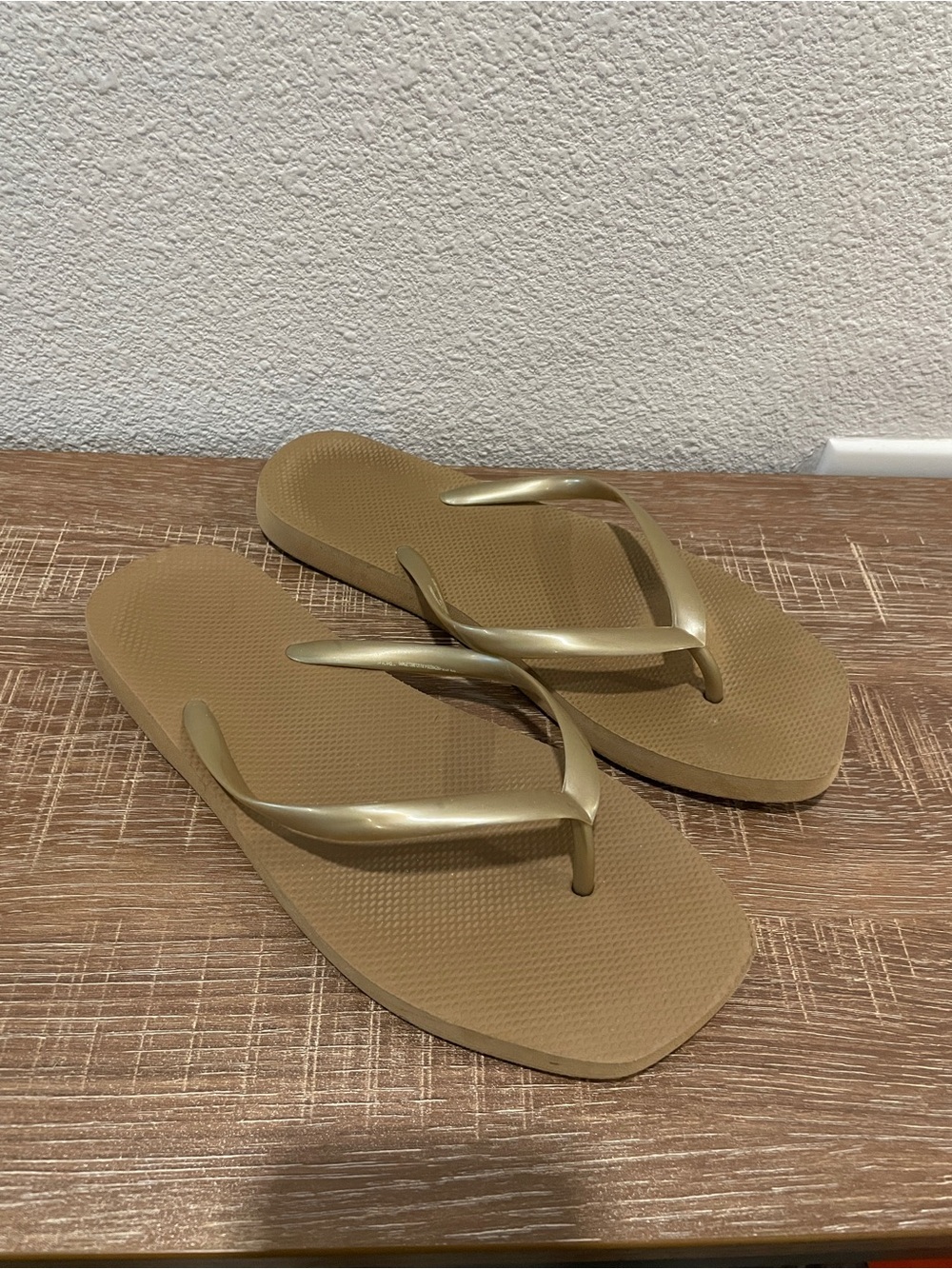 Gold flip flops